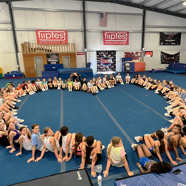 Cheer Fest kids seated in heart shape